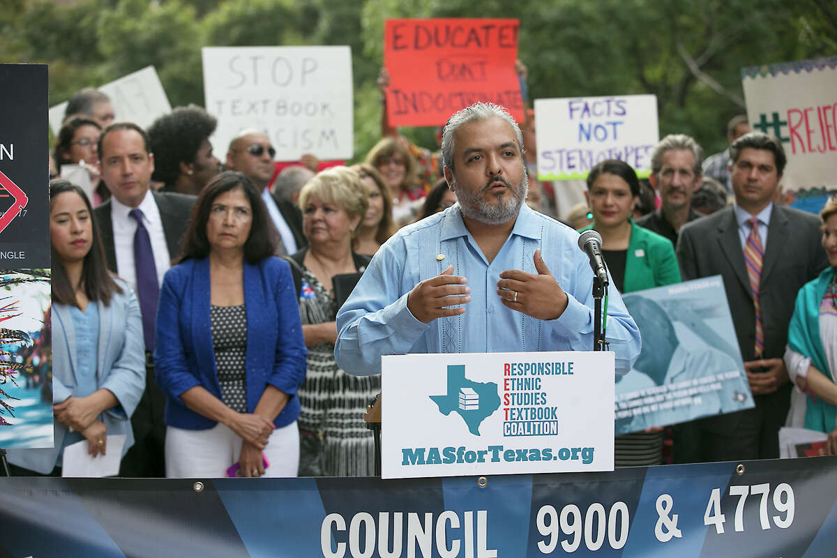 State Board of Education member Ruben Cortez Jr. joins ﻿Mexican-American advocates and activists at a rally ﻿opposing ﻿the ﻿textbook "Mexican American Heritage" Tuesday in Austin.﻿