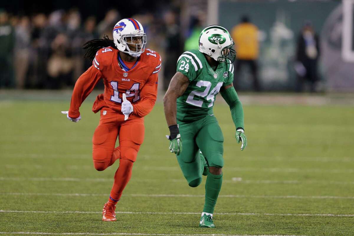 FILE - In this Nov. 12, 2015, file photo, Buffalo Bills wide receiver Sammy Watkins, left, is defended by New York Jets cornerback Darrelle Revis during the first half of an NFL football game, in East Rutherford, N.J. The NFL isn't colorblind to the concerns of its TV audience regarding the "Color Rush" alternate uniforms the Bills and Jets will wear Thursday night, Sept. 14, 2016. That's a switch from last year, when Buffalo wore all red and the Jets all green during their prime-time game on Nov. 12. The combinations led to colorblind viewers complaining they couldn't determine which team was which. (AP Photo/Seth Wenig, File) ORG XMIT: NY163