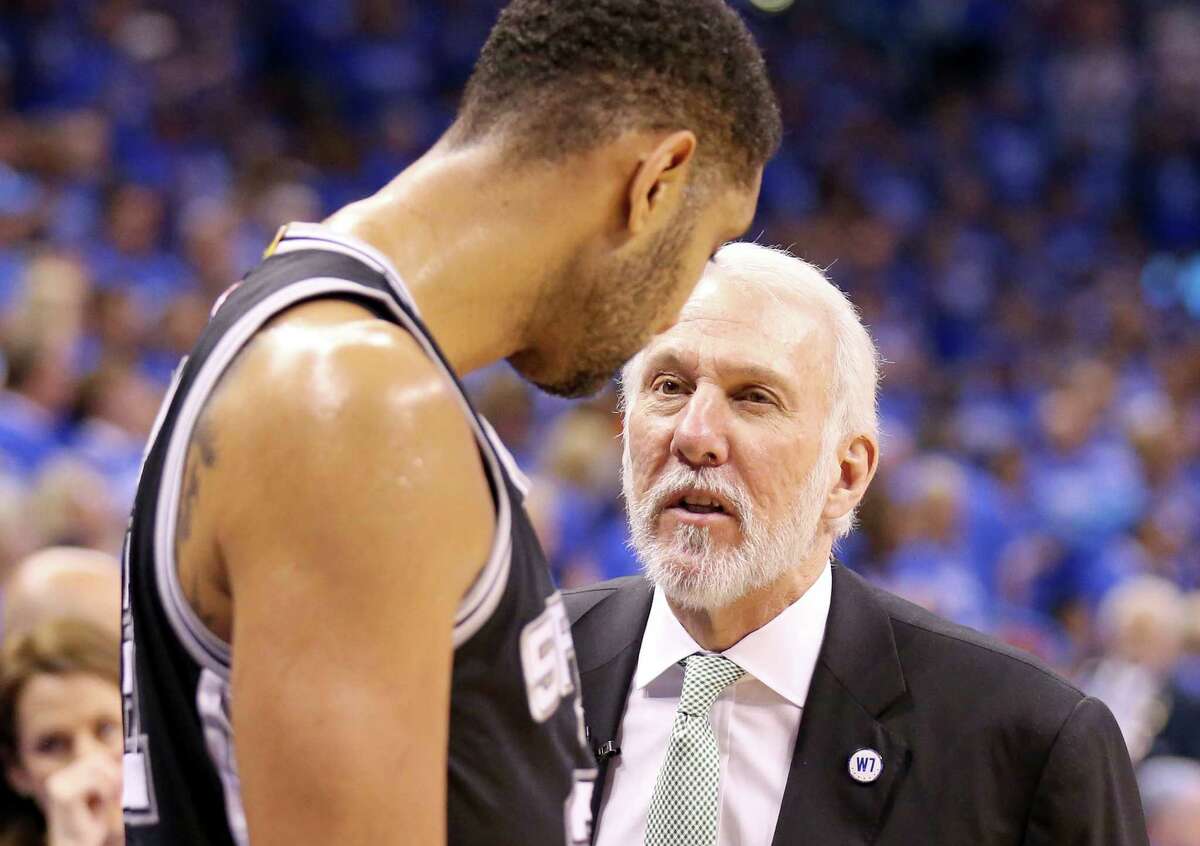 Spurs’ Tim Duncan talks with head coach Gregg Popovich during second half action of Game 6 in the Western Conference semifinals against the City Thunder on May 12, 2016, at Chesapeake Energy Arena in Oklahoma City.