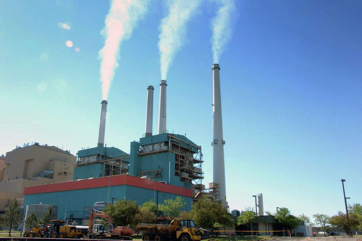 In this July 1, 2013, file photo, smoke rises from the Colstrip Steam Electric Station, a coal burning power plant in Colstrip, Mont. Most Americans are willing to pay a little more each month to fight global warming, but only a tiny bit, according to a new poll. Still environmental policy experts hail that as a hopeful sign. Seventy-one percent of the American public want the federal government to do something about global warming, including six percent of the people who think the government should act even though they are not sure that climate change is happening, according to a poll conducted by The Associated Press-NORC Center for Public Affairs Research and the Energy Policy Institute at the University of Chicago. (AP Photo/Matthew Brown, File)