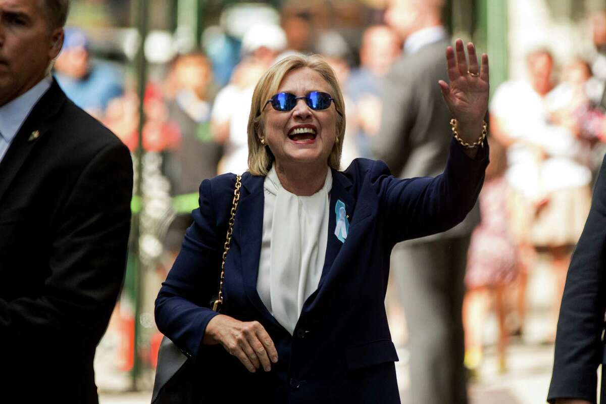 FILE - In this Sept. 11, 2016 file photo, Democratic presidential candidate Hillary Clinton waves after leaving an apartment building in New York. Hillary Clinton's doctor says she is recovering from her pneumonia and remains "healthy and fit to serve as President of the United States." The statement was part of medical information Clinton's campaign released Wednesday, Sept. 14, 2016, after her pneumonia diagnosis last week. (AP Photo/Andrew Harnik, File)