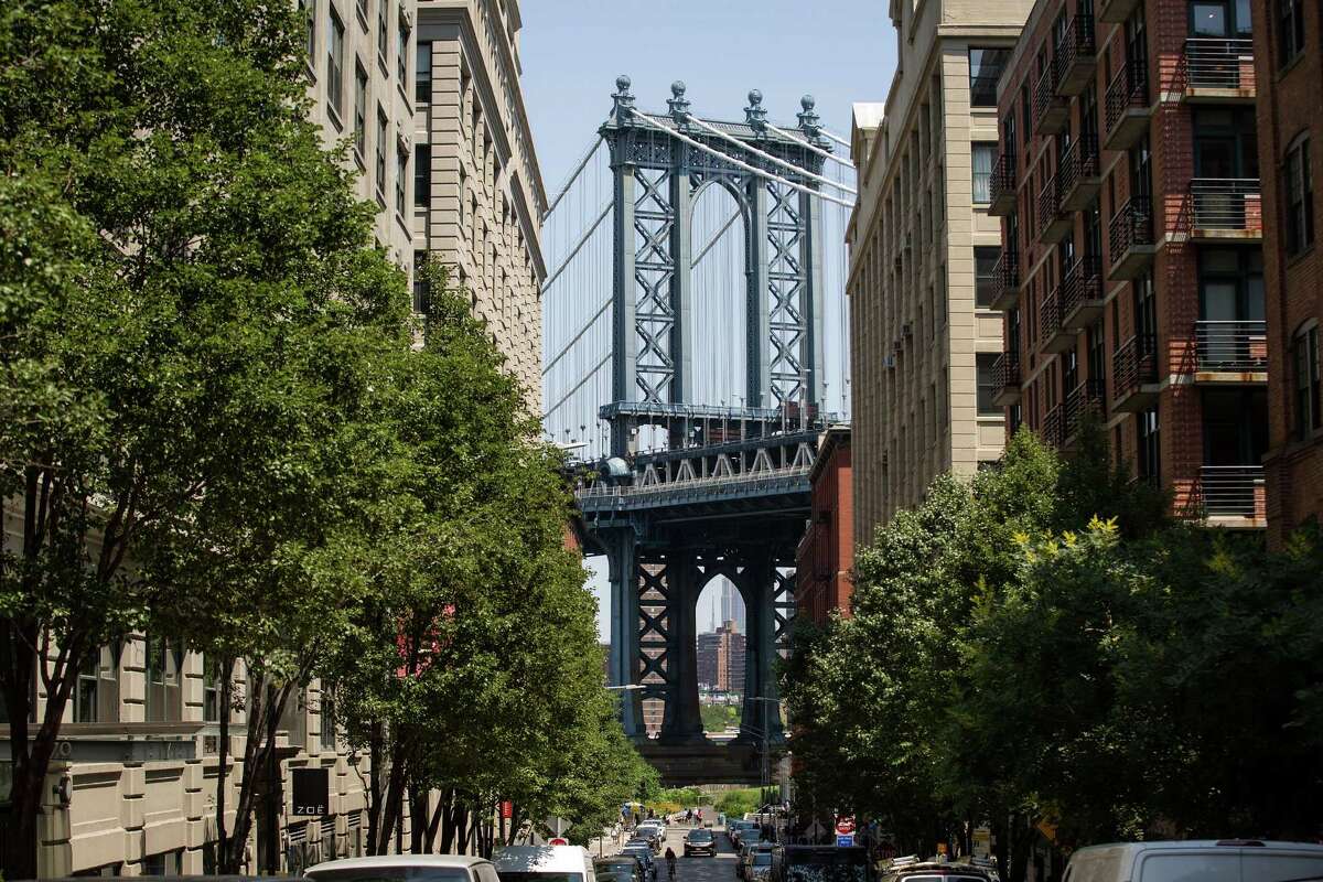 NEW YORK, NY - JUNE 24: A view of the Manhattan Bridge in the DUMBO neighborhood on June 24, 2016 in the Brooklyn borough of New York City. According to a survey released on Thursday by real-estate firm RealtyTrac, Brooklyn ranked as the most unaffordable place to live in the United States. (Photo by Drew Angerer/Getty Images)