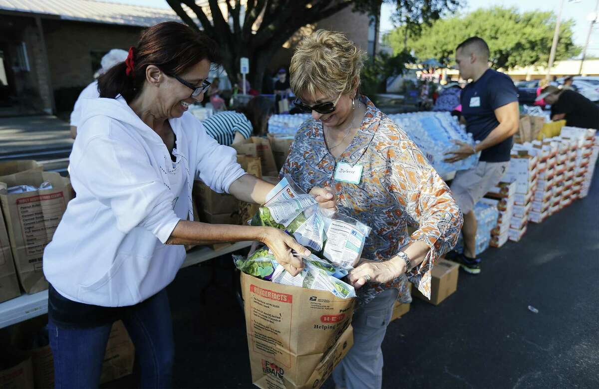 The needs are great for those living in poverty in Texas and many — such as these volunteers gathering food for the poor at Windcrest United Methodist Church on Sept. 15. But helping the needly will be hampered by a census undercount, cheating Texas of needed federal funds.