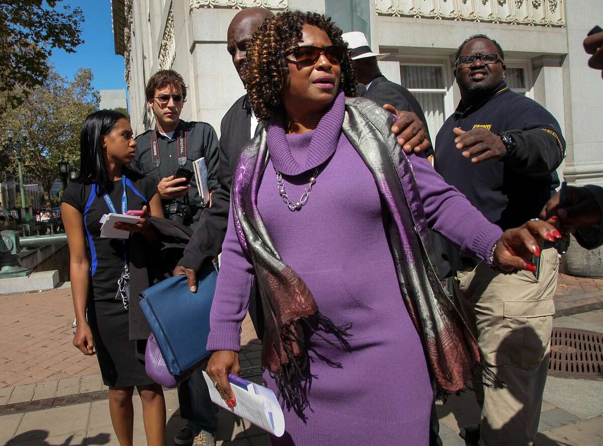 From front: Attorney Pamela Price, following a news conference, walks away from reporters, at the Frank H. Ogawa Plaza on Thursday, Sept. 15, 2016 in Oakland, Calif. Attorneys addressed members of the media about Jasmine, the sexually-exploited teen who went by the name Celeste Guap.
