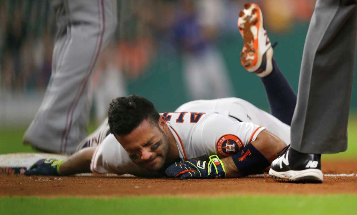 Houston Astros Jose Altuve (27) reacts after he was tagged out at first base following a single during the sixth inning of an MLB game at Minute Maid Park, Tuesday, Sept. 13, 2016 in Houston. ( Karen Warren / Houston Chronicle )