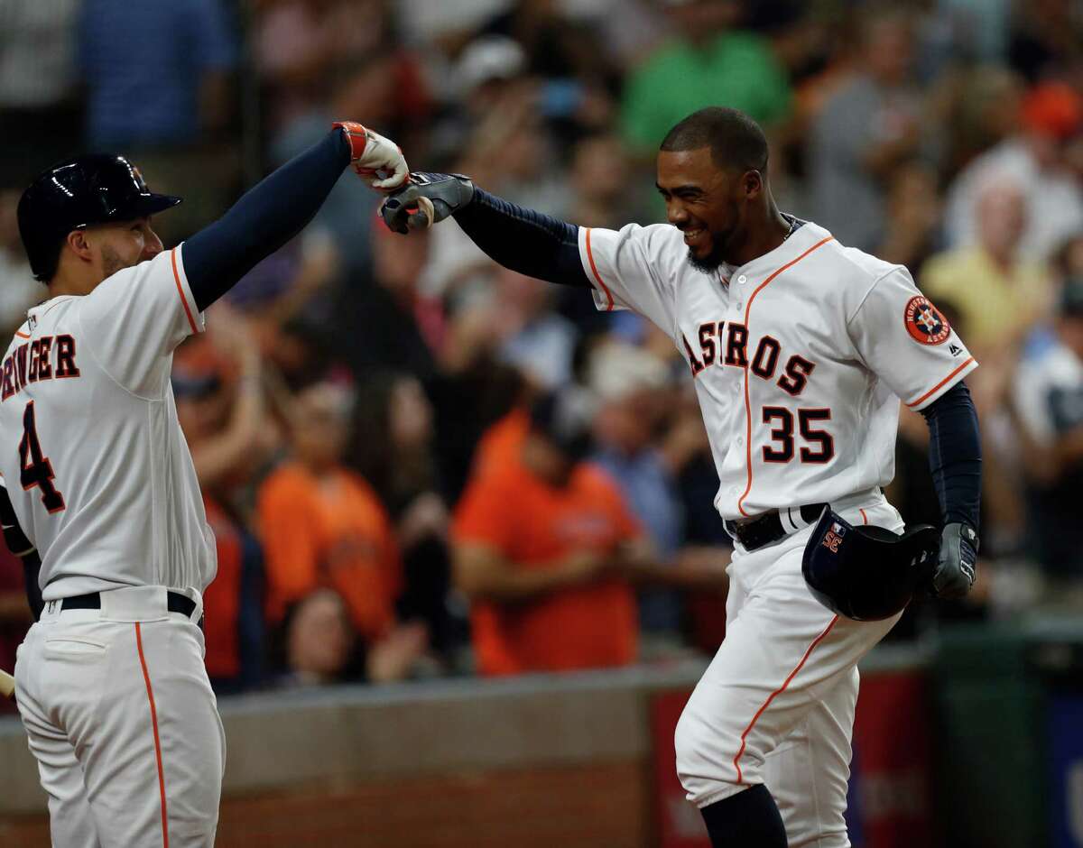 Houston Astros center fielder Teoscar Hernandez (35) celebrates with George Springer after hitting a two-run home run during the second inning of an MLB game at Minute Maid Park, Wednesday, Sept. 14, 2016 in Houston. ( Karen Warren / Houston Chronicle )