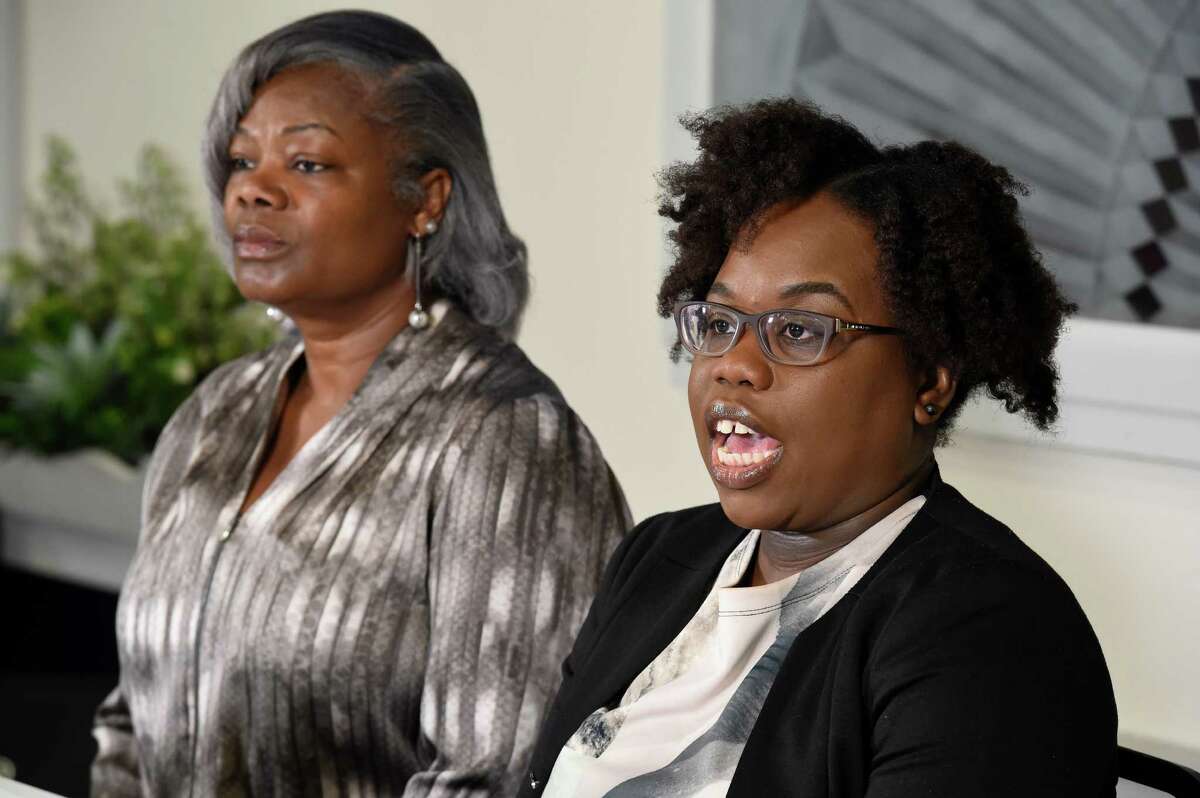 Gertha DePas, mother of Edson Thevenin, who was shot by Troy Police Sgt. French, left, is joined by her daughter-in-law Cinthia Thevenin during a press conference April 28, 2016, at the Empire Christian Center in Albany, N.Y. (Skip Dickstein/Times Union)