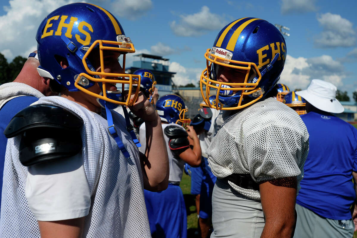 New Evadale wide receiver Kolten Mackey, right, talks with teammates during practice on Sept. 14.