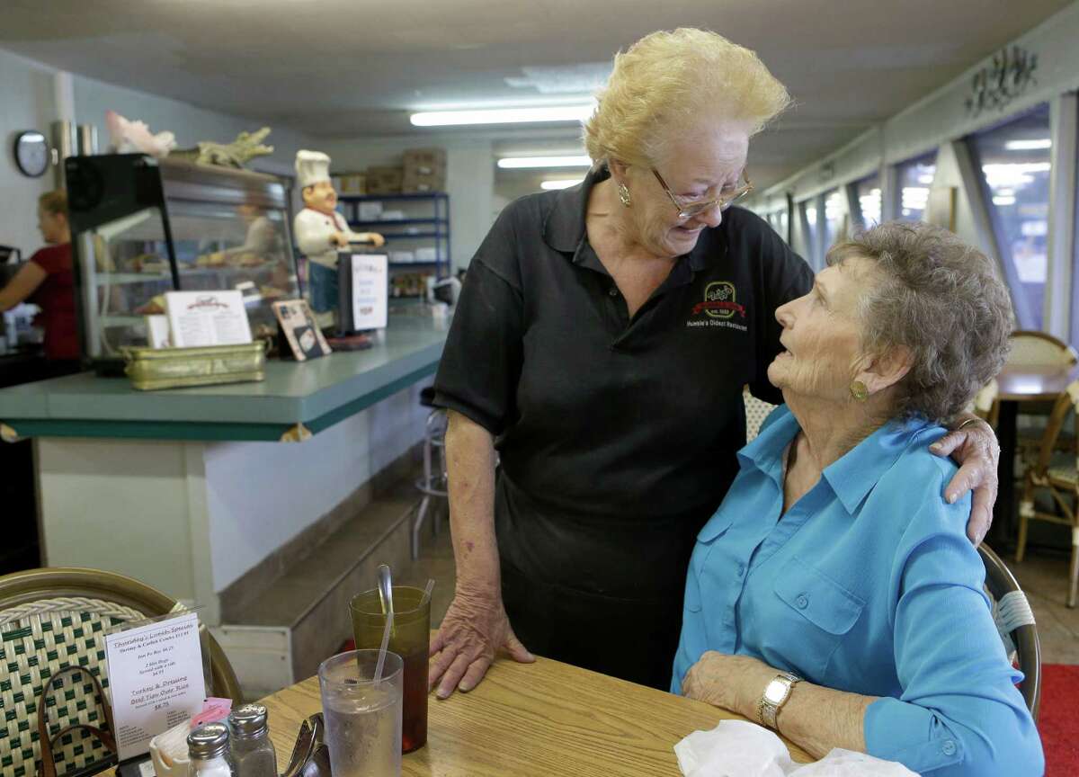 Waitress Sharon Harris, left, hugs actress Margaret Bowman, who is a regular at Trigg's Humble Inn, 1410 1st St. East, Thursday, Sept. 8, 2016 in Humble. Margaret plays a waitress in the new movie, Hell or High Water and based her character partially on her own mother and Sharon Harris. She has appeared in other movies such as No Country for Old Men, The Lone Ranger, Bernie, and A Perfect World. ( Melissa Phillip / Houston Chronicle )