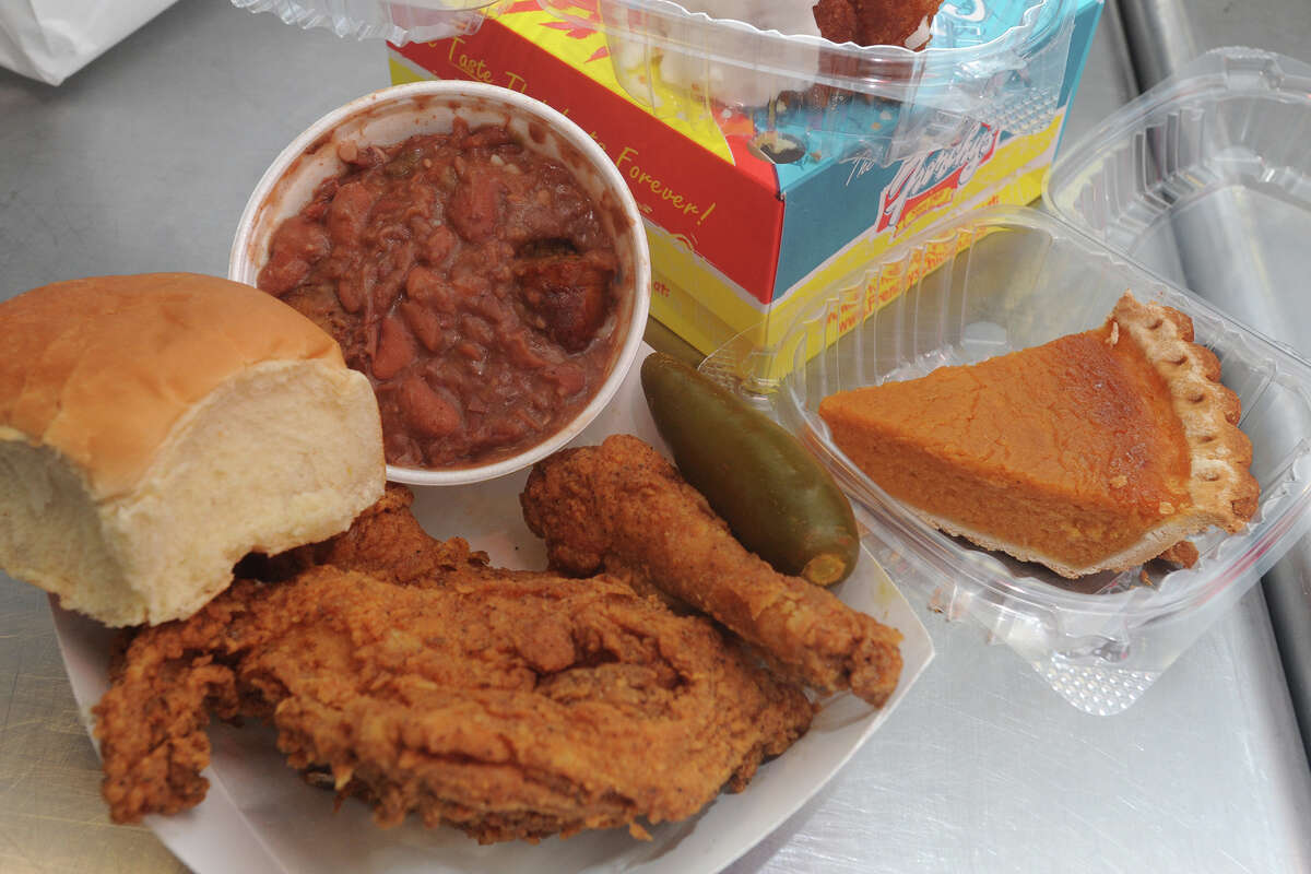 A three-piece meal served with beans and rice at Frenchy's Chicken.