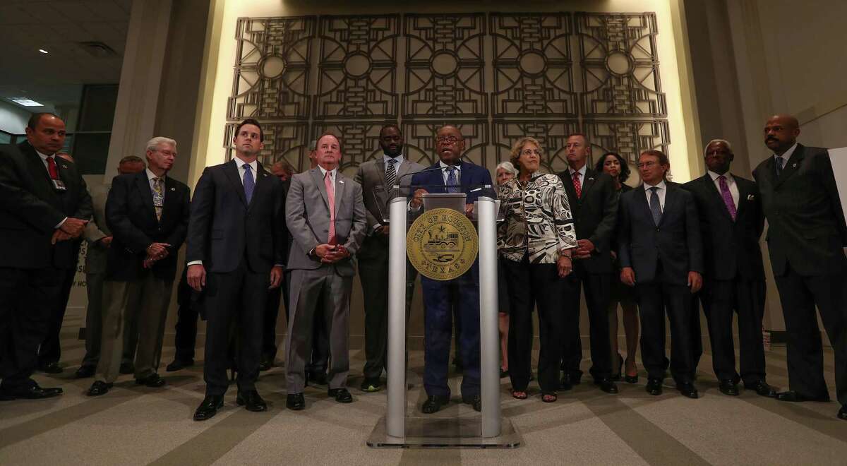 Representatives from the police and municipal employee pension boards joined city officials for the announcement of a tentative pension reform deal, but they did not comment on theplan. The fire pension board did not attend. ( Steve Gonzales / Houston Chronicle )