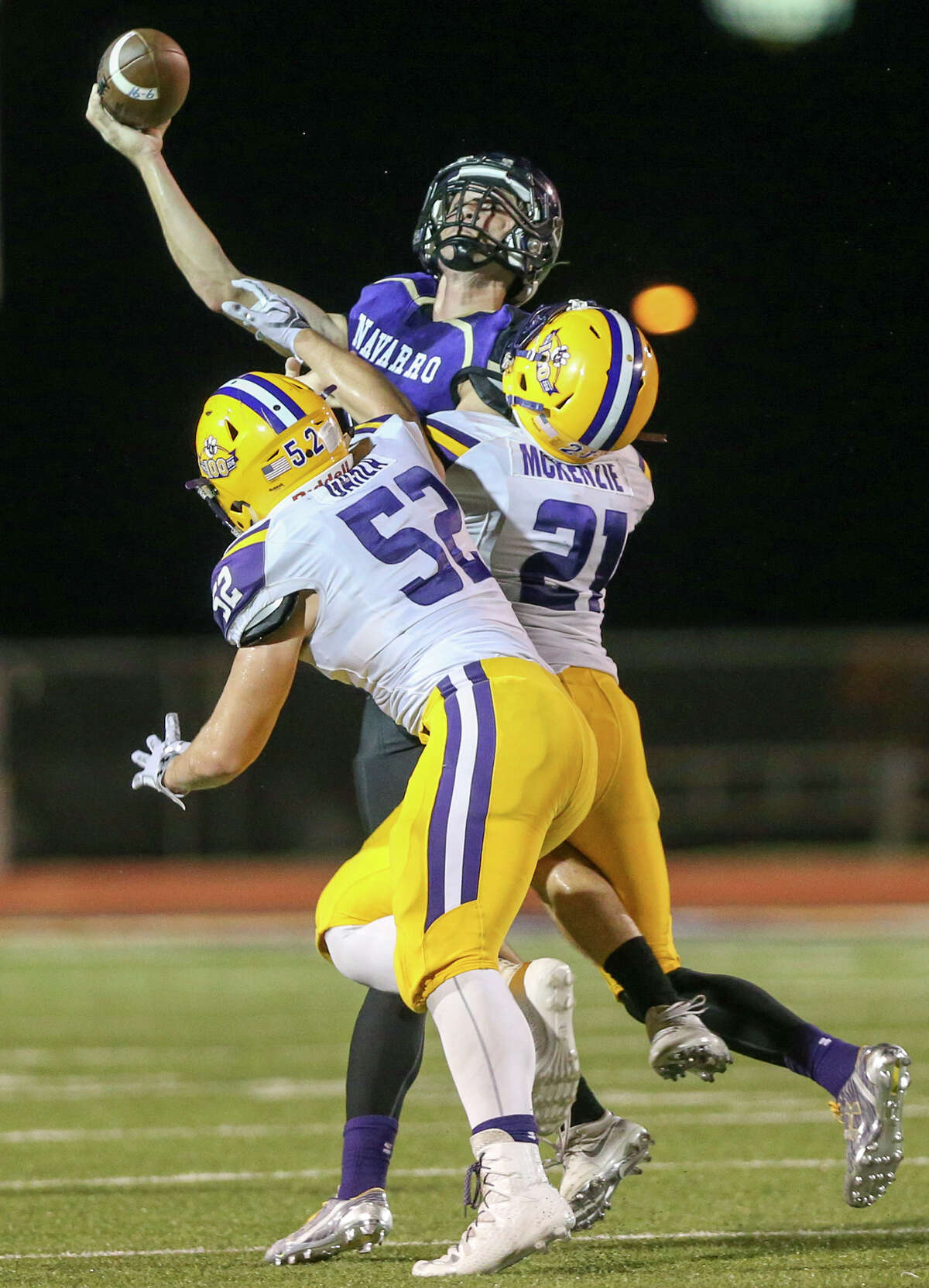 Navarro quarterback Will Eveld tries to pass the ball under pressure from La Grange's Dameon McKenzie (right) and John Garza during the first half of their non-district game at Erwin-Lee Field in Geronimo on Friday, Sept. 16, 2016. MARVIN PFEIFFER/ mpfeiffer@express-news.net