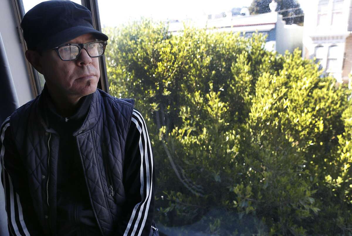 Randy Gzebb is seen with a ficus tree growing in front of his Fillmore Street home in San Francisco, Calif. on Saturday, Sept. 17, 2016. Gzebb and his neighbors have been forced to pay repair costs for sidewalk damage caused by the tree's root system. But responsibility for sidewalk repair and tree maintenance would become the city's if Prop. E passes in Novemenber.