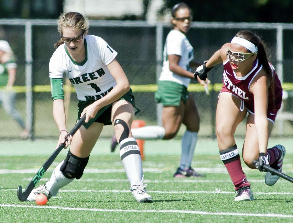 New Milford High School's Michaela Ferlow pushes the ball as Bethel High School's Manuella Rios tries to block during a game at New Milford. Saturday, Sept. 17, 2016