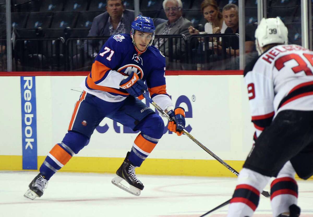 NEW YORK, NY - SEPTEMBER 23: Michael Dal Colle #71 of the New York Islanders skates against the New Jersey Devils at the Barclays Center on September 23, 2015 in the Brooklyn borough of New York City. The Islanders defeated the Devils 2-1. (Photo by Bruce Bennett/Getty Images)