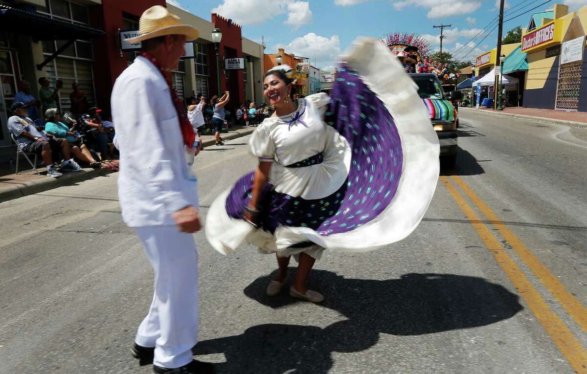 Ballet Folklorico de San Antonio dancers perform as they take part in the Avenida Guadalupe neighborhood Diez y Seis de Septiembre Parade on Saturday, Sept. 17, 2016. Hundreds of parade watchers lined the streets on the city's Westside as about 60 floats, marchers and bands cruised through to celebrate Mexico's independence from Spain. Food, music and presentations followed throughout the day at Plaza de Guadalupe. (Kin Man Hui/San Antonio Express-News)