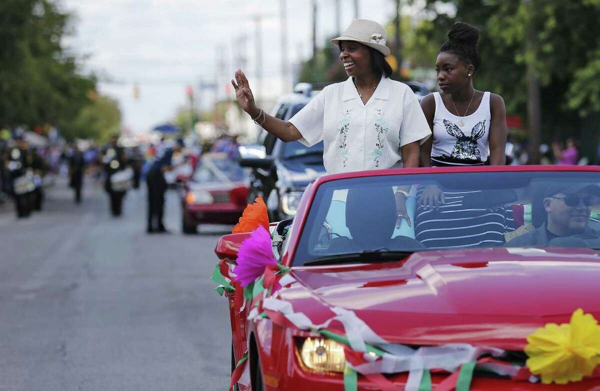 Mayor Ivy Taylor and her daughter, Morgan, wave to the crowd as she takes part in the Avenida Guadalupe neighborhood Diez y Seis de Septiembre Parade on Saturday, Sept. 17, 2016. Hundreds of parade watchers lined the streets on the city's Westside as about 60 floats, marchers and bands cruised through to celebrate Mexico's independence from Spain. Food, music and presentations followed throughout the day at Plaza de Guadalupe.