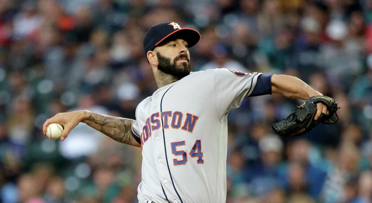 Houston Astros starting pitcher Mike Fiers throws against the Seattle Mariners during the first inning of a baseball game Saturday, Sept. 17, 2016, in Seattle. (AP Photo/Elaine Thompson)