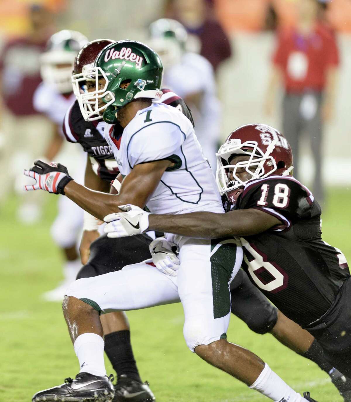 Tre Simms (7) of the Mississippi Valley State Devils is brought down by Jeremiah Credit (18) of the TSU Tigers in the second half of a SWAC college football game on Saturday, September 17, 2016 at BBVA Compass Stadium in Houston Texas.