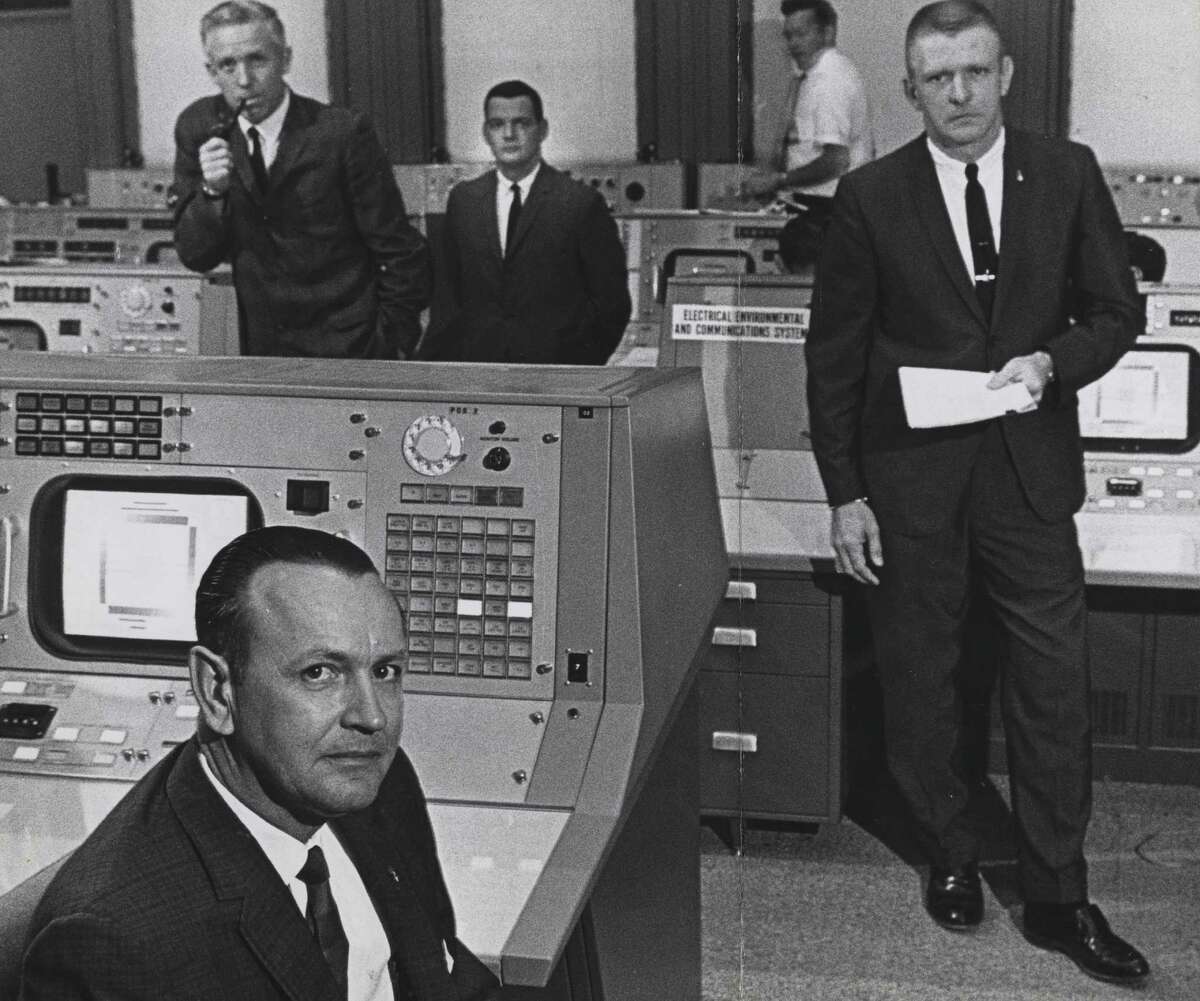Christopher Kraft, foreground, and colleagues at NASA's Mission Control, from left, ﻿John D. Hodge, ﻿ Glynn Lunney﻿ ﻿and Gene Kranz﻿.