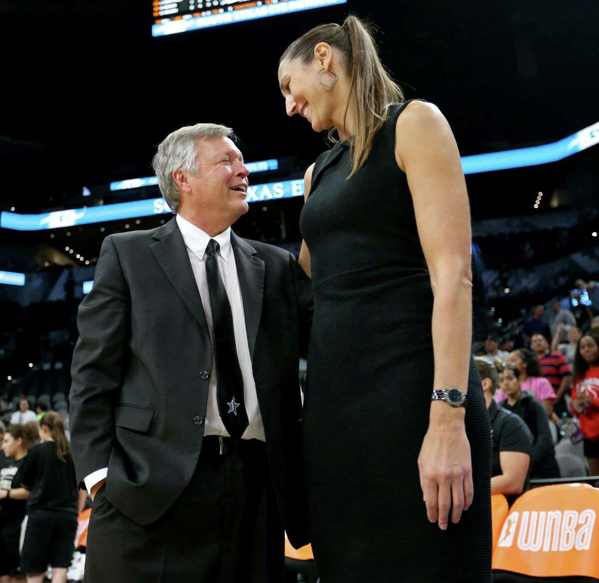 Former Stars head coach Dan Hughes (left) talks with general manager Ruth Riley after the game with the Phoenix Mercury on Sept. 18, 2016 at the AT&T Center.