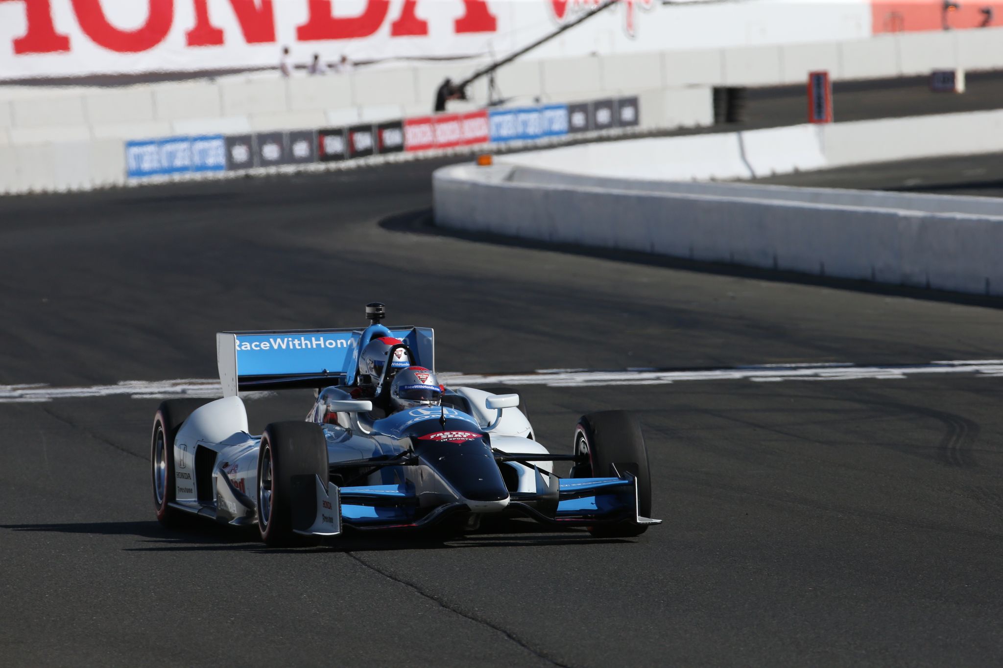 Kawhi Leonard smiles, goes racing with Mario Andretti at IndyCar 