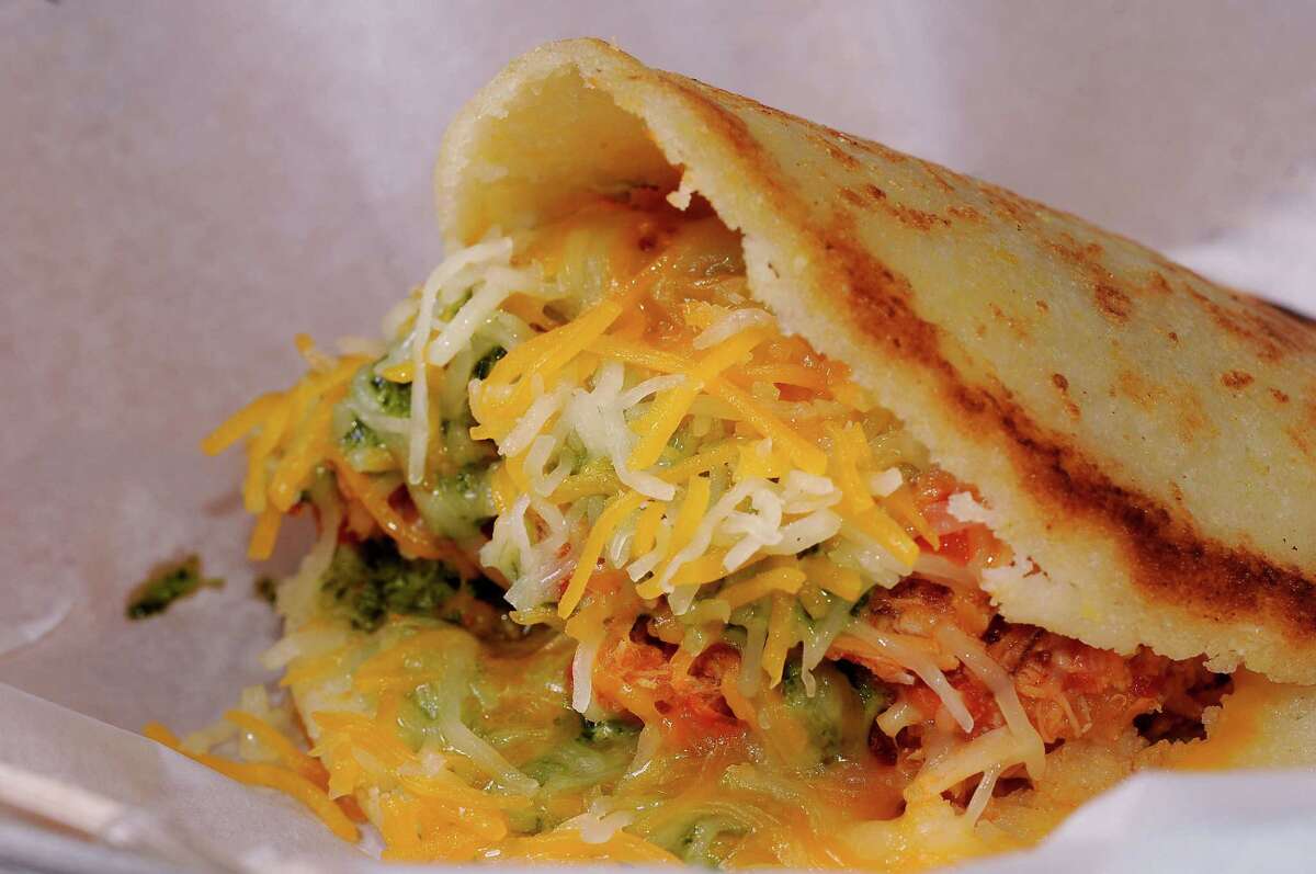 The La Catira arepas at Gusto Gourmet is made with shredded chicken, shredded cheese and homemade sauce.