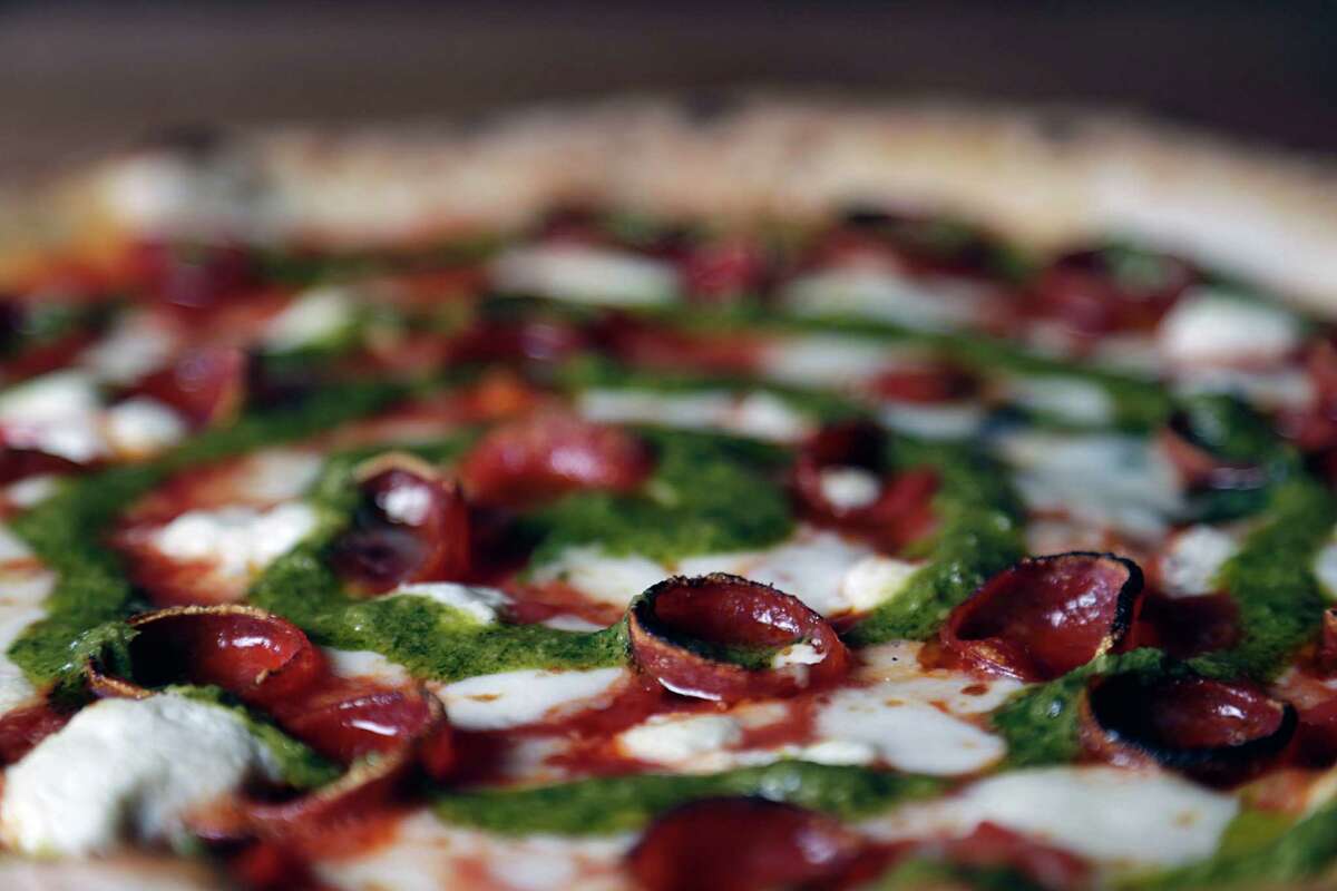 The Joan Marie pizza, pepperoni, housemade mozzarella, goat cheese and roasted jalapeno pesto at Cane Rosso Sept. 14, 2016, in Houston. ( James Nielsen / Houston Chronicle )