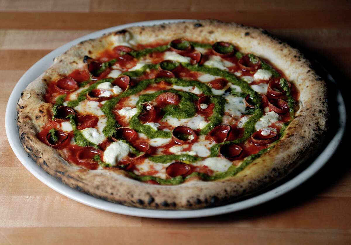 The Joan Marie pizza, pepperoni, housemade mozzarella, goat cheese and roasted jalapeno pesto at Cane Rosso, Houston.