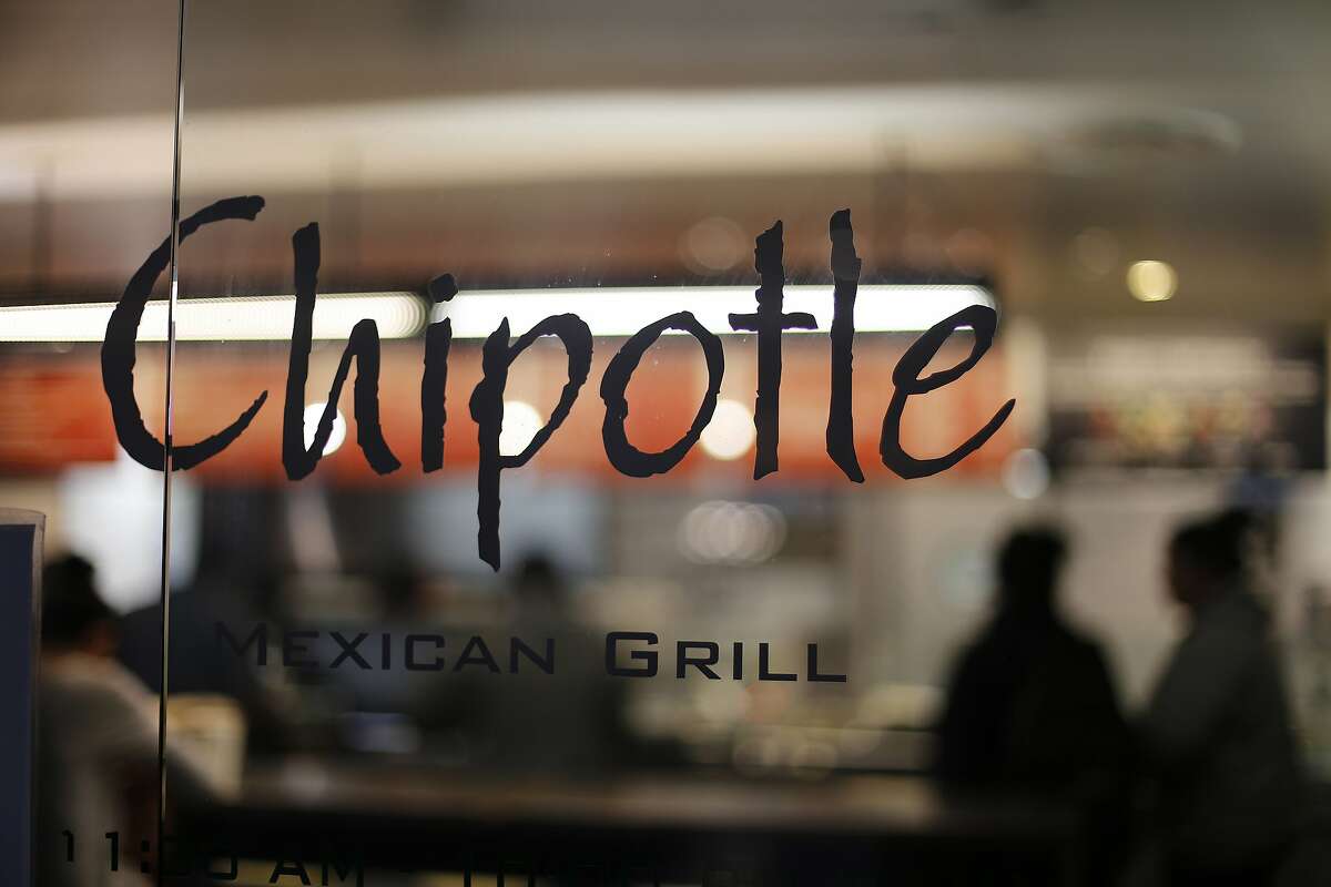 FILE - This Sunday, Dec. 27, 2015, file photo, shows a Chipotle restaurant in Union Station in Washington. Chipotle says its top marketing executive is back on the job, after being placed on leave during the summer of 2016 as a result of drug possession charges. The burrito chain says Mark Crumpacker's return was announced internally Sept. 8. Crumpacker is Chipotle's chief creative and development officer and had been in charge of the Denver company's efforts to win back customers after an E. coli outbreak last year sent sales plunging. (AP Photo/Gene J. Puskar, File)