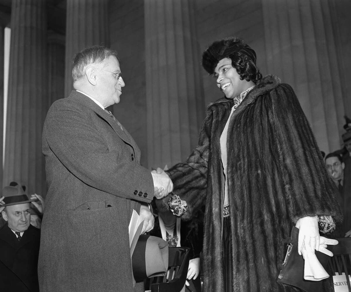 American contralto, Miss Marian Anderson, right, is shown with secretary of interior Harold Ickes before the latter introduced her to a crowd of 75,000 persons at outdoor concert on steps of Lincoln Memorial in Washington, D.C. on Easter Sunday, April 9, 1939. (AP Photo)