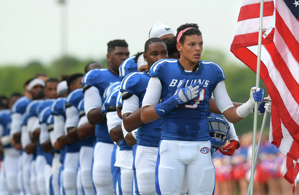 West Brook players hold their hands over their hearts during the National Anthem during a recent game at the Thomas Center. The Beaumont Independent School District has mandated that all players stand during the Anthem. Photo taken Friday, August 26, 2016 Guiseppe Barranco/The Enterprise