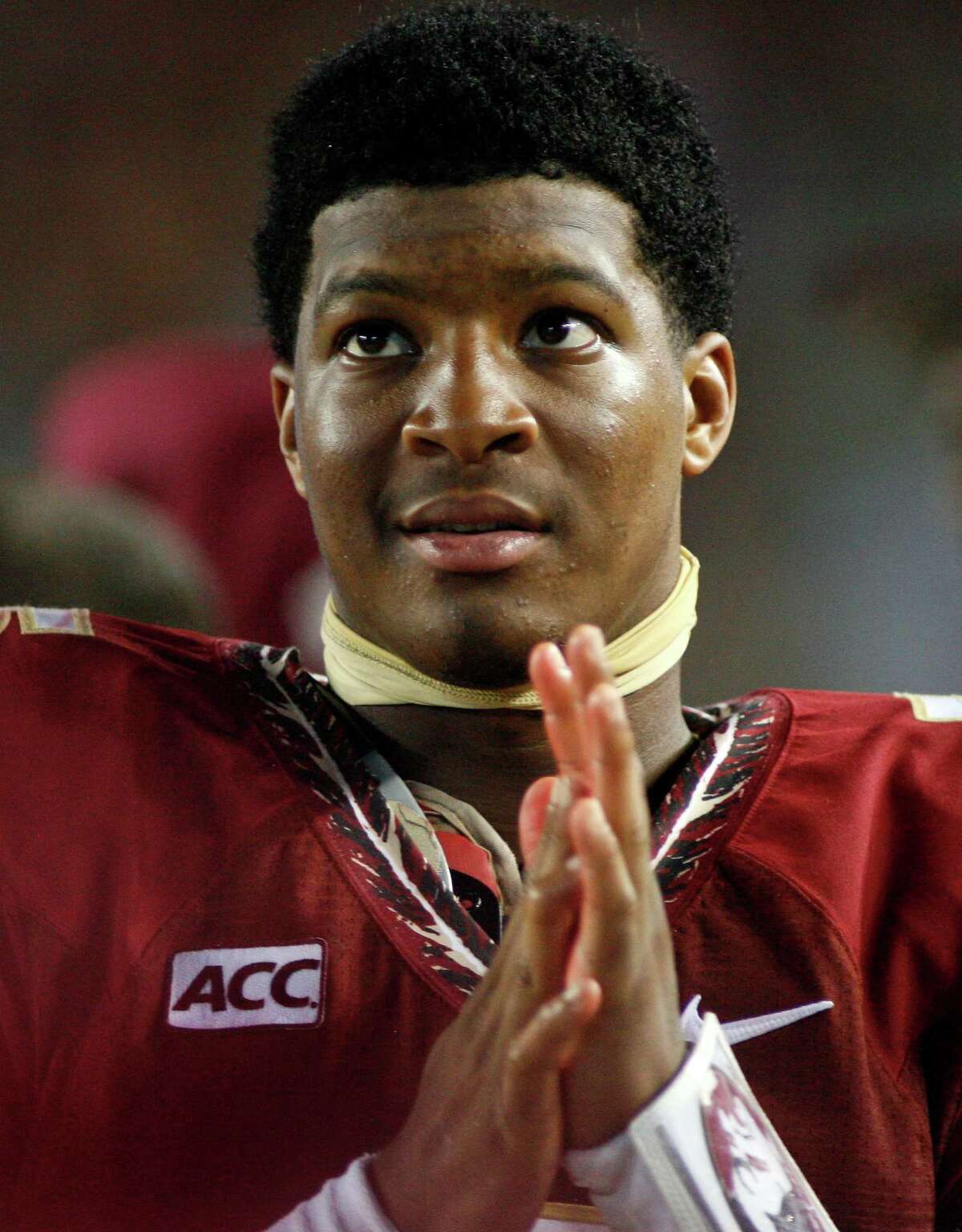 In this Sept. 21, 2013, file photo, Florida State quarterback Jameis Winston watches from the sidelines during the second half against Bethune-Cookman in Tallahassee, Fla. Search warrants, released Dec. 5, 2013, in the sexual assault investigation of Winston indicate the woman told police she was raped at an apartment after a night of drinking at a bar. State Attorney Willie Meggs said there was not enough evidence to pursue charges in the sex assault case against Winston.