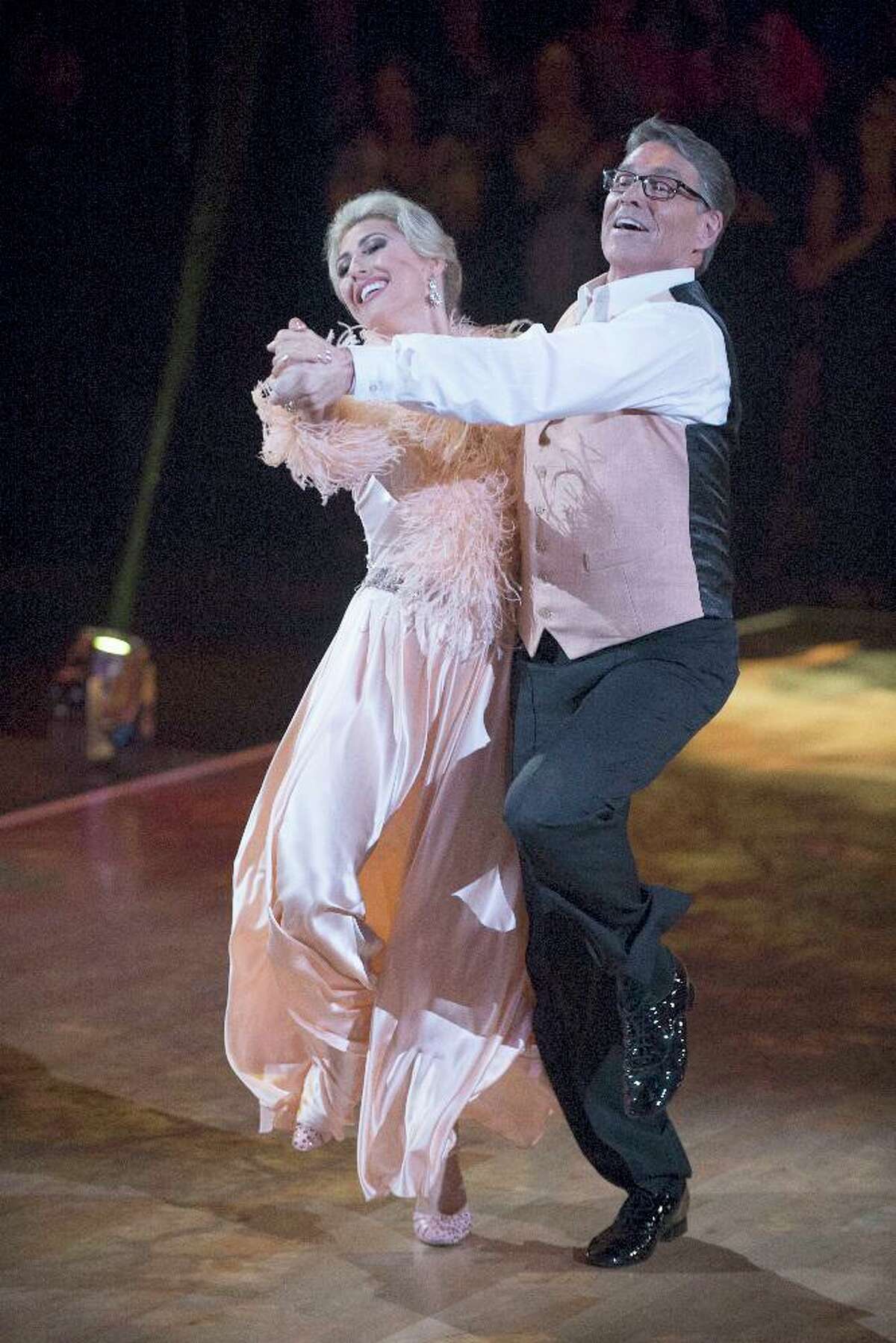 Rick Perry and Emma Slater take a twirl on “Dancing with the Stars.” A reader thinks this was more honest work than joining the Trump administration.