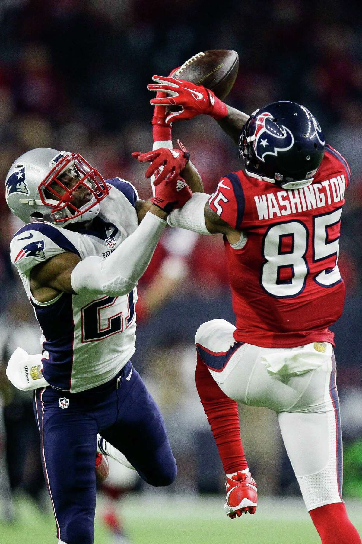 Patriots cornerback Malcolm Butler, known for a Super Bowl-deciding interception, breaks up a pass intended for Nate Washington, right, during last year's game against the Texans.