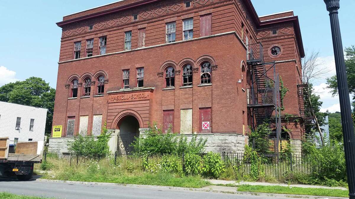 The city-owned former Haskell School property along Sixth Avenue in the Lansingburgh neighborhood of Troy, before a fire in June further damaged the roof. (Photo by Chris Churchill / Times Union)