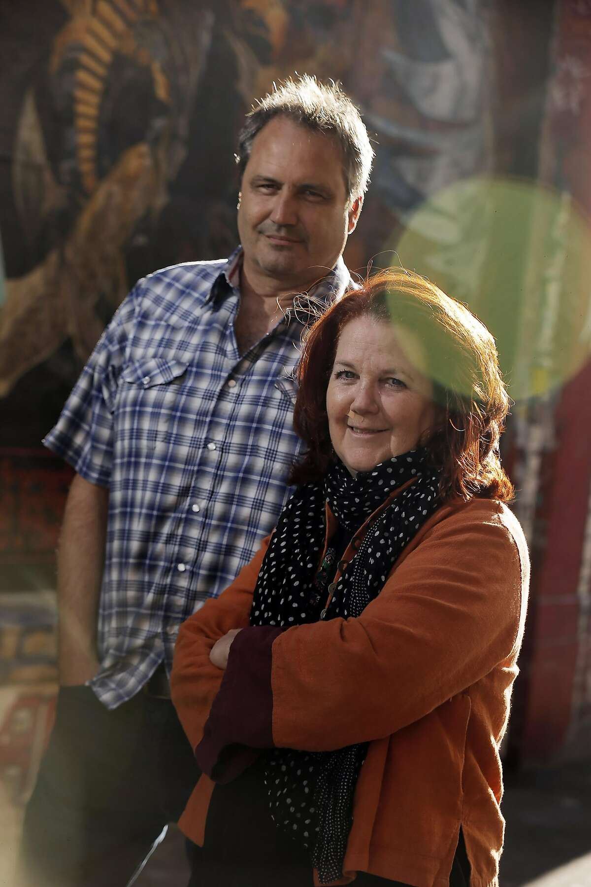 Litquake founders Jack Boulware, left, and Jane Ganahl, right, in Clarion Alley in San Francisco, Calif.,. on Wednesday, September 17, 2014. Litquake, San Francisco's annual literary festival, is celebrating its 15th anniversary.
