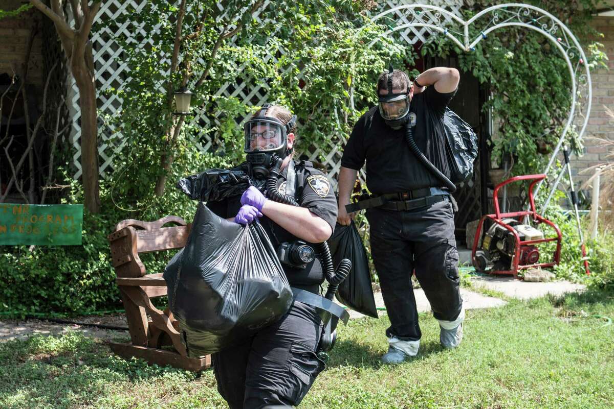 San Antonio investigators remove animals from a home on the Southwest Side Wednesday morning, September 21, 2016.