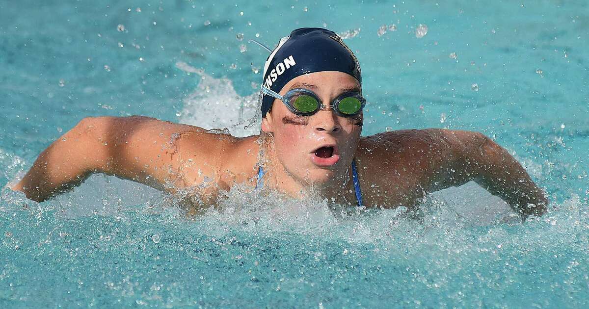 Wilton's Katie Stevenson powers through the water in the 100 butterfly during Wednesday's dual meet against Trumbull at the Wilton Y pool.