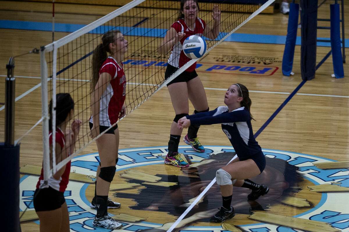 Meridian's Kassidy Zmikly bumps the ball on Wednesday at Meridian High School.