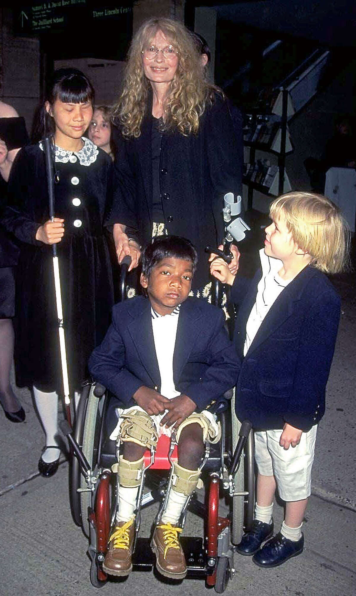 Actress Mia Farrow and her children, including Thaddeus, center.