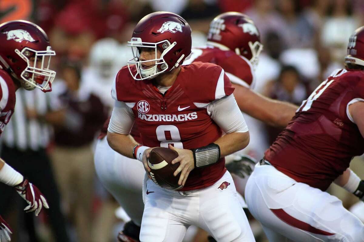Arkansas’ Austin Allen looks to hand the ball off during the first quarter against Texas State on Sept. 17, 2016, in Fayetteville, Ark.