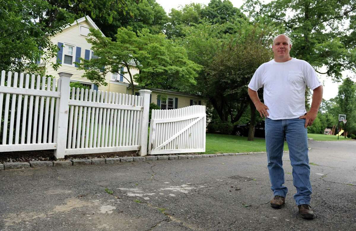 David Fredericks stands in the driveway of his Stratford home where he alleges an altercation took place with Stratford Police Det. William Jennings on April 18, 2011.