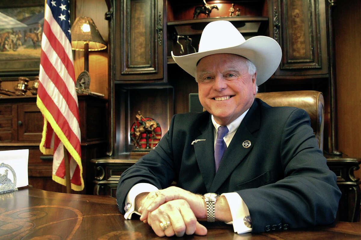 Agriculture Commissioner Sid Miller sits at his desk in his office on March 4, 2015. He's the target of a pair of ads that allege he is waging a war against BBQ. 