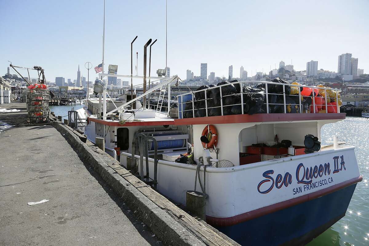 In this photo taken Friday, Nov. 6, 2015, is the Sea Queen II docked at Fisherman's Wharf in San Francisco. Abdul Fatah and Sorihin, Indonesian fishermen who escaped slavery aboard the Honolulu-based tuna and swordfish vessel when it docked at San Francisco's Fisherman's Wharf are suing the boat's owner for tricking them into accepting dangerous jobs they say they weren't allowed to leave. Attorneys for the fisherman said in a lawsuit filed in federal court Thursday, Sept. 22, 2016, that they were recruited in Indonesia years ago to work in Hawaii's commercial fishing fleet without realizing they would never be allowed onshore. (AP Photo/Eric Risberg)