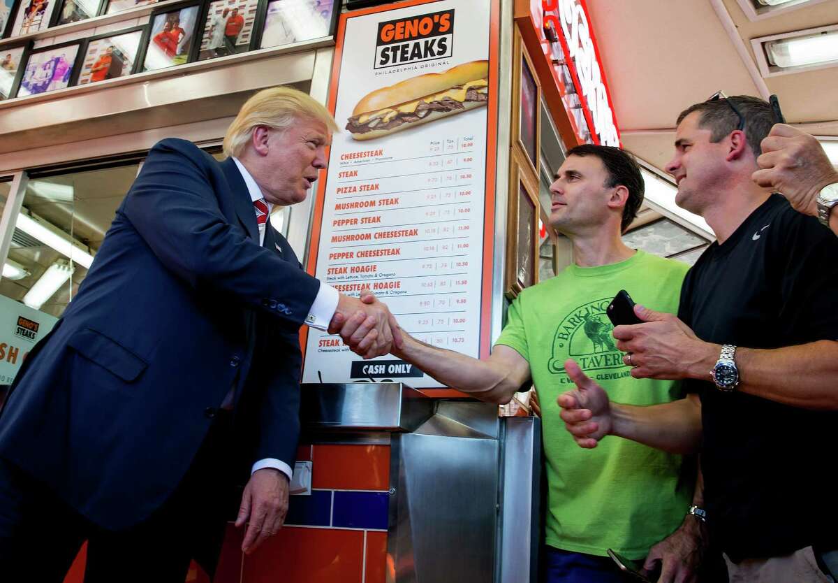 GOP candidate Donald Trump, greeting customers at Geno's Steaks in Philadelphia, would repeal the Affordable Care Act and amend Medicaid.