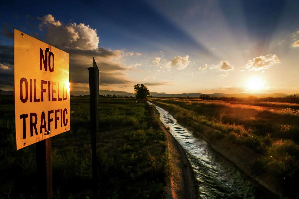 A sign prohibiting oilfield traffic along county road 320 sits next to a canal full of water from the natural spring at Balmorhea State Park Friday, Sept. 16, 2016 in Balmorhea. Houston-based Apache Corporation recently announced the discovery of an estimated 15 billion barrels of oil and gas in the area and plans to drill and use hydraulic fracturing on the 350,000 acres surrounding the town. Apache has leased the mineral rights under the town and nearby state park, but has promised not to drill on or under either. While some residents worry that the drilling could affect the spring at the park and impact tourism, others are excited for the potential economic boom the oil discovery and drilling could bring. ( Michael Ciaglo / Houston Chronicle )