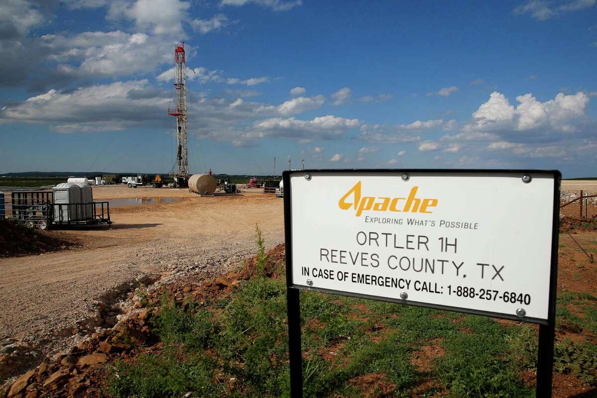 A drilling rig sits north of the Davis Mountains Friday, Sept. 16, 2016 in Balmorhea. Houston-based Apache Corporation recently announced the discovery of an estimated 15 billion barrels of oil and gas in the area and plans to drill and use hydraulic fracturing on the 350,000 acres surrounding the town. Apache has leased the mineral rights under the town and nearby state park, but has promised not to drill on or under either. While some residents worry that the drilling could affect the spring at the state park and impact tourism, others are excited for the potential economic boom the oil discovery and drilling could bring. ( Michael Ciaglo / Houston Chronicle )