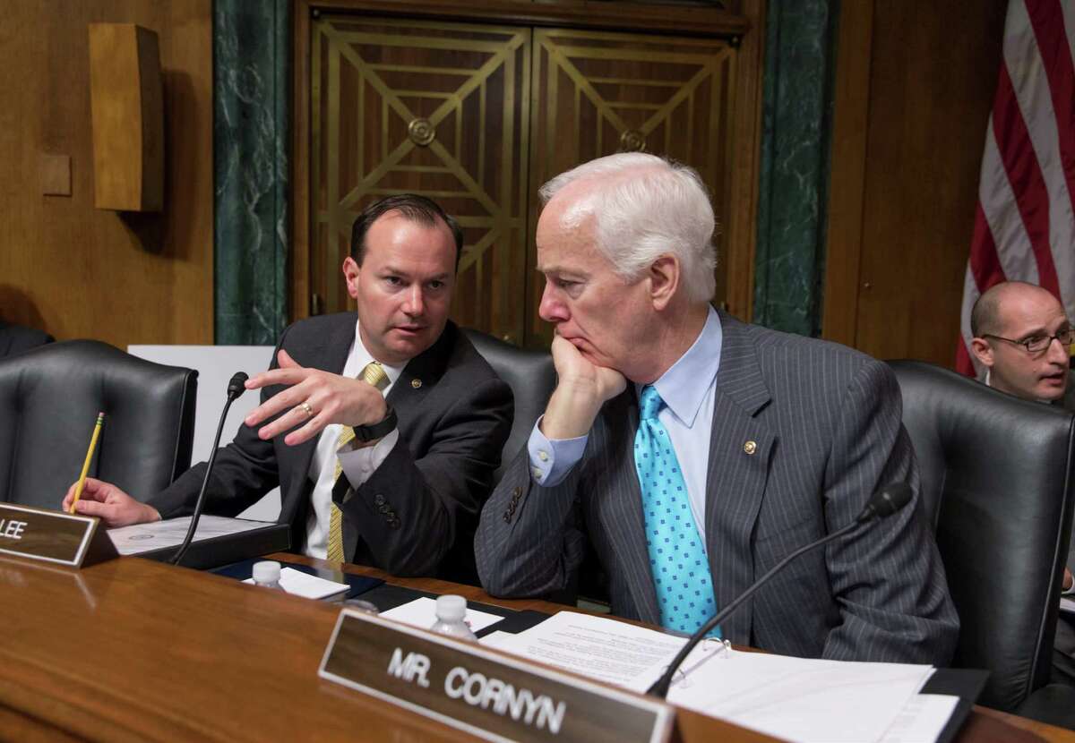 In this March file photo, Sen. Mike Lee, R-Utah, left, confers with Sen. John Cornyn, R-Texas. Hopes for overhauling the nations criminal justice system have faded in Congress this year, undercut the pressure of election-year politics.