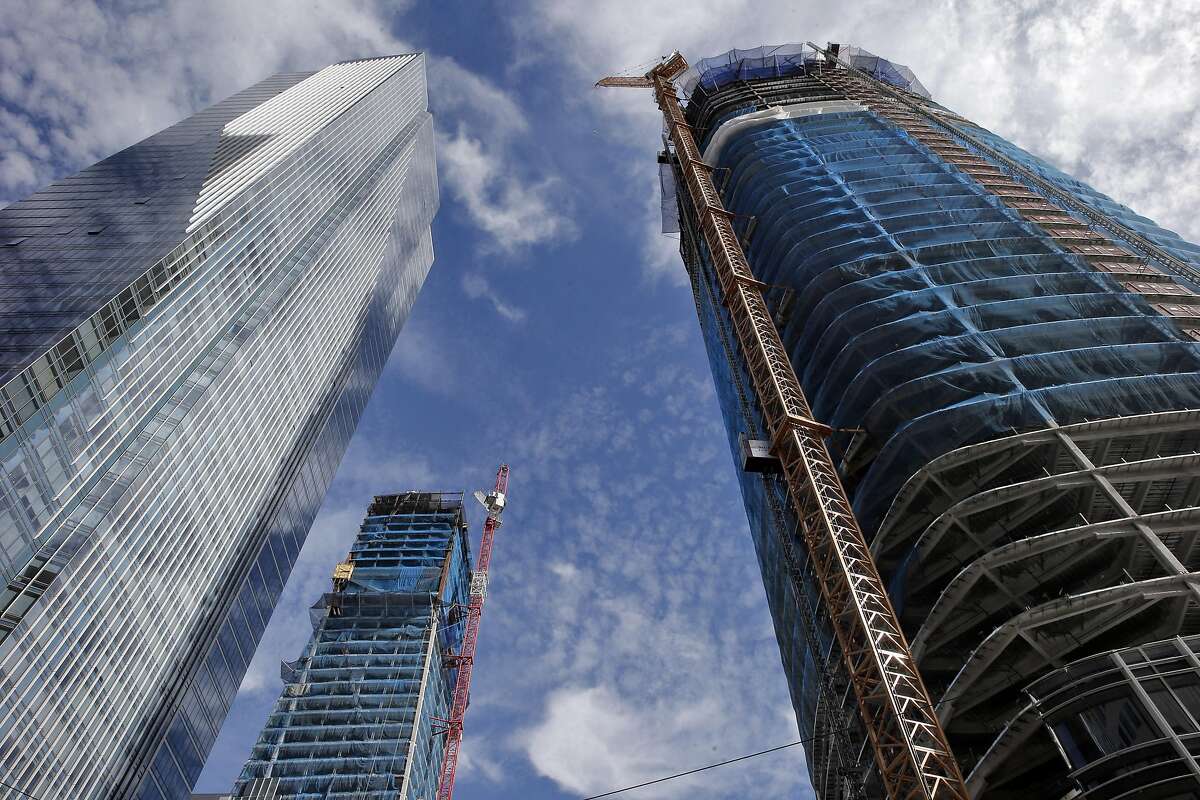 The Millennium tower on the left, across the street from the location of a new proposed plaza tucked into the southwest corner of the intersection of Mission and Fremont Streets next to the new Salesforce Tower on the right in San Francisco , Calif., on Monday, August 29, 2016.